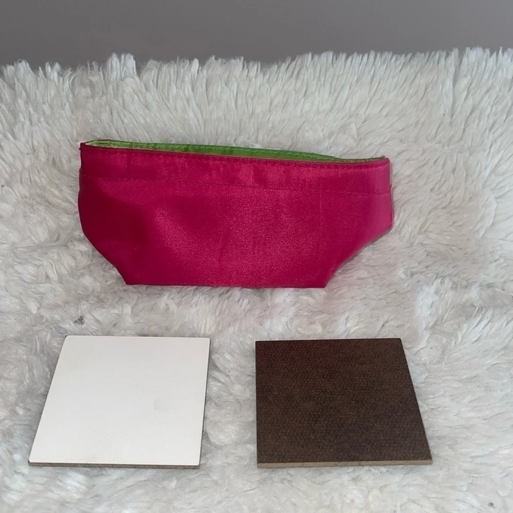 Pencil bag and 2 sample painting boards with Velcro stickers on the back .